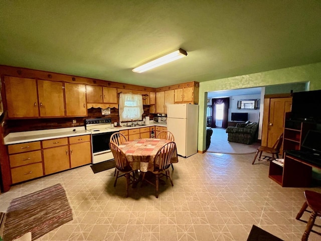 kitchen featuring sink and white appliances