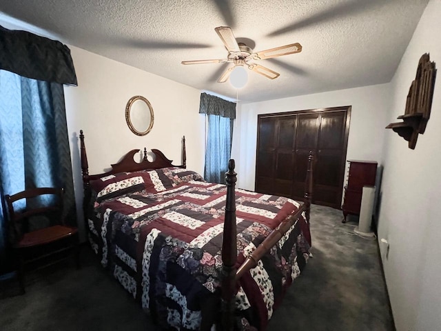 bedroom featuring a textured ceiling, dark colored carpet, ceiling fan, and a closet