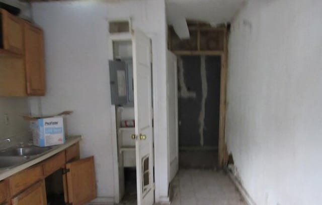 kitchen featuring electric panel and sink