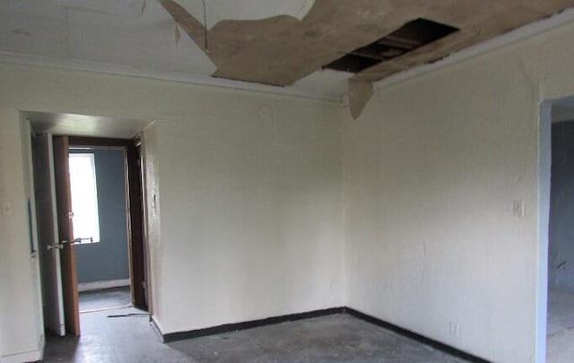 unfurnished room featuring concrete flooring