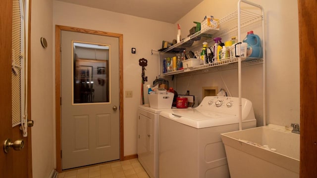 washroom with sink and washer and clothes dryer