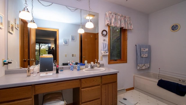 bathroom with vanity, tile patterned flooring, and a bath