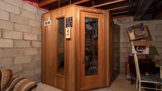 view of sauna featuring concrete flooring