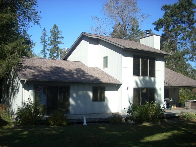 back of house with a yard and a patio area