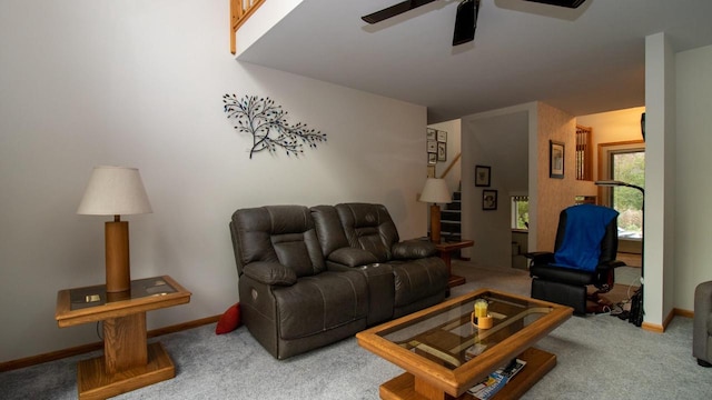 living room featuring carpet floors and ceiling fan