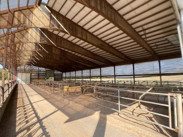 view of horse barn featuring a rural view