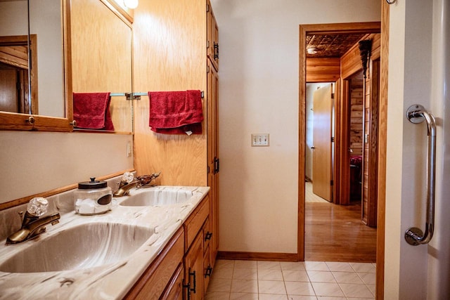 bathroom featuring tile patterned flooring and vanity