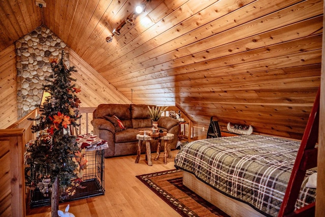 bedroom featuring wooden walls, vaulted ceiling, hardwood / wood-style flooring, and wooden ceiling