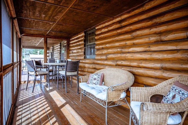 sunroom featuring wood ceiling