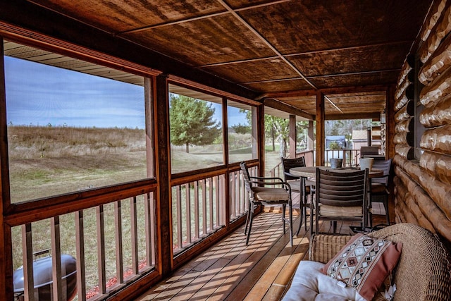 unfurnished sunroom featuring wood ceiling