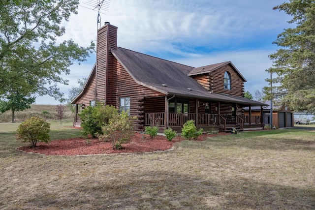 exterior space featuring a lawn and covered porch