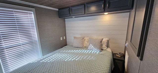 unfurnished bedroom featuring ornamental molding, wood walls, and wooden ceiling