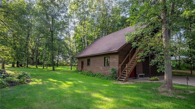 view of property exterior with a lawn