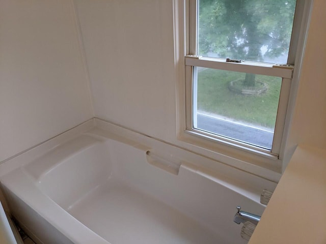 bathroom featuring a tub