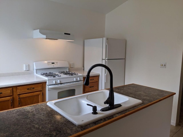 kitchen featuring sink, light tile patterned floors, white appliances, and ventilation hood