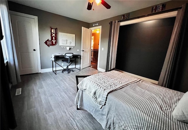 bedroom with ceiling fan and light hardwood / wood-style flooring