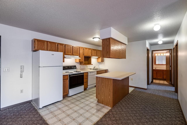 kitchen with white appliances, a textured ceiling, a center island, sink, and light carpet