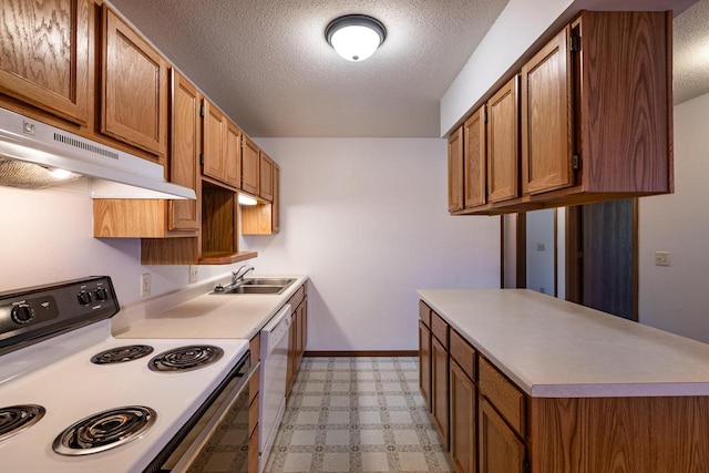 kitchen with a textured ceiling, white appliances, and sink