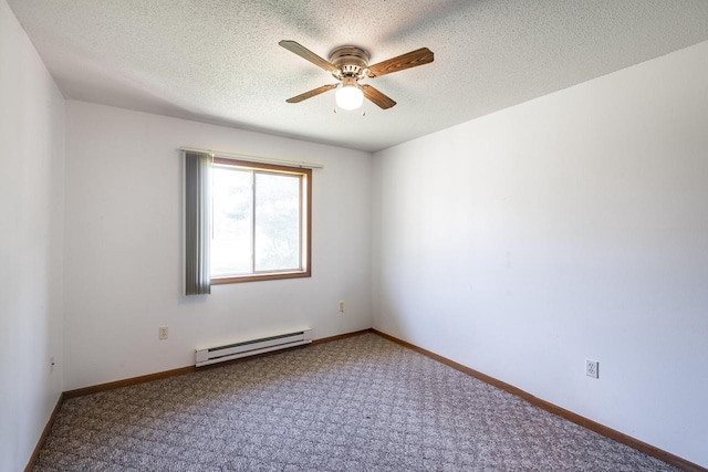 empty room with ceiling fan, a textured ceiling, carpet flooring, and a baseboard heating unit