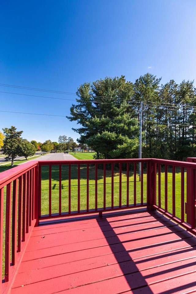 wooden deck with a yard