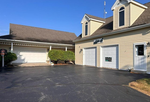 new england style home with a garage