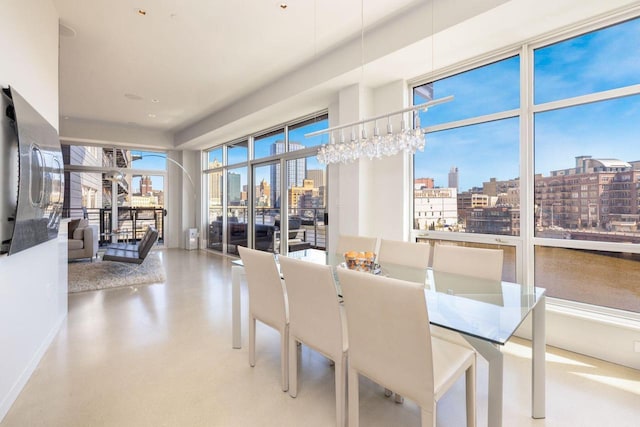 dining space featuring concrete floors