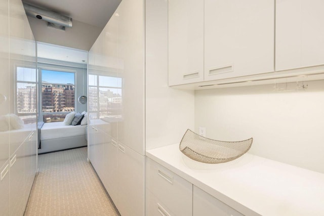 laundry area featuring light tile patterned floors