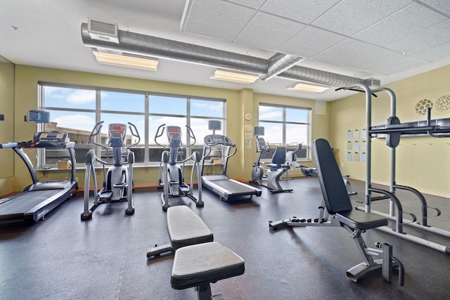 gym featuring a drop ceiling