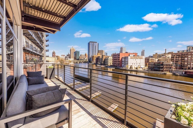 balcony featuring a water view