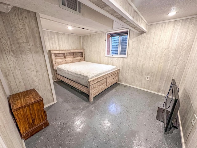 bedroom with a textured ceiling and wooden walls