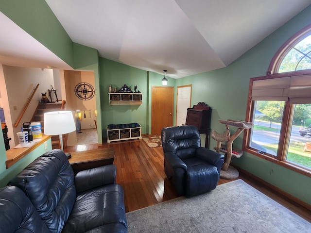 living room with lofted ceiling and hardwood / wood-style flooring