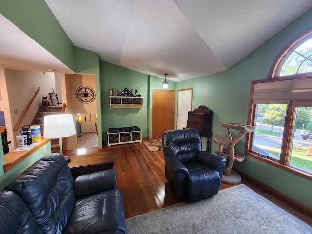 living room with wood-type flooring and lofted ceiling