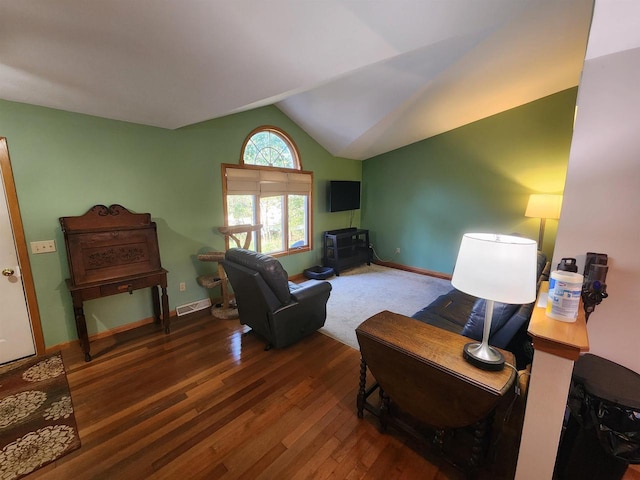 living room with vaulted ceiling and dark wood-type flooring