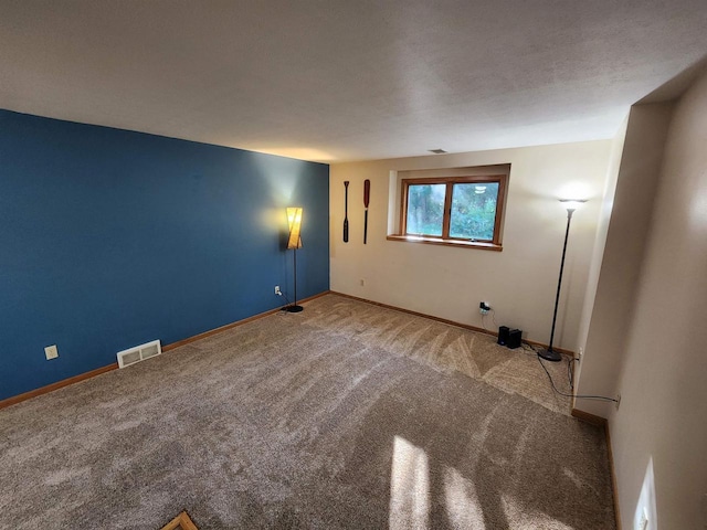 empty room featuring carpet flooring