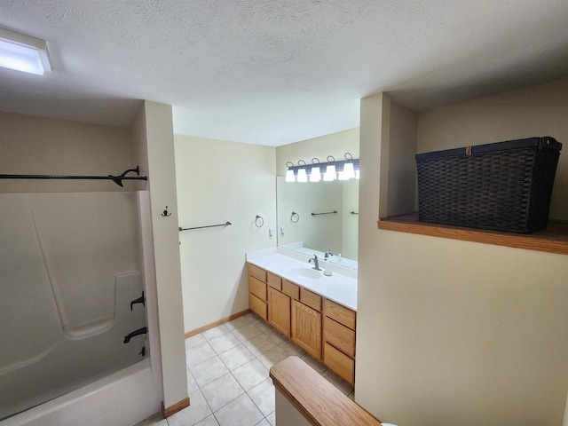 bathroom featuring plenty of natural light, vanity,  shower combination, and tile patterned floors