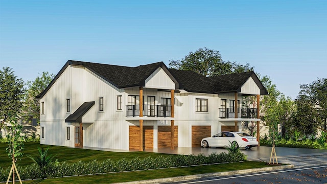 modern farmhouse featuring a front lawn, a garage, and a balcony