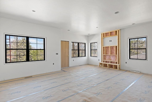 396 Strauss Ave, Green Lake, WI 54941 - unfurnished room with a healthy amount of sunlight and visible vents