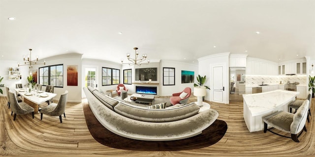 living room featuring a chandelier, light wood finished floors, and recessed lighting