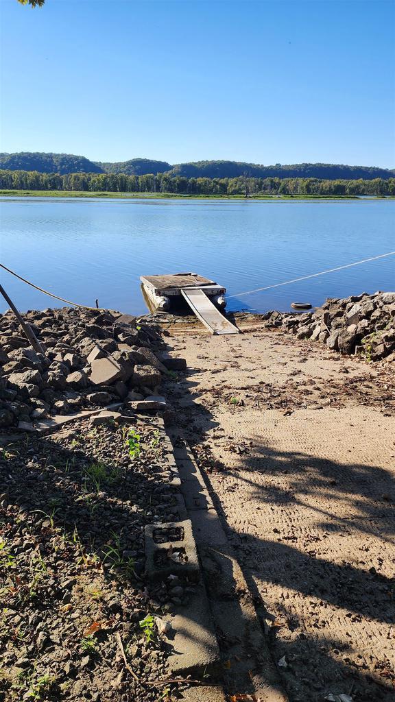 property view of water with a dock