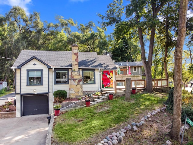 view of front of property with a garage and a wooden deck