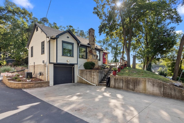 view of side of property with a garage