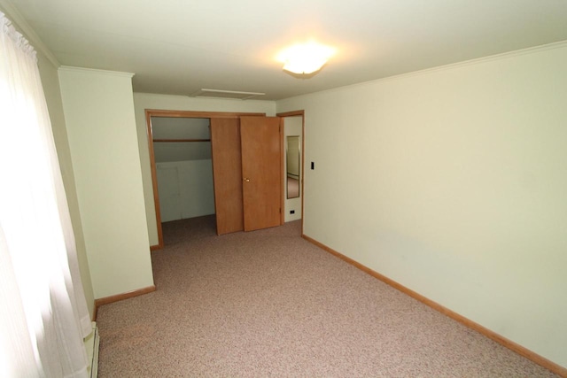 unfurnished bedroom with ornamental molding, light carpet, and a closet