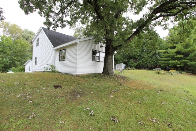 view of home's exterior with a lawn