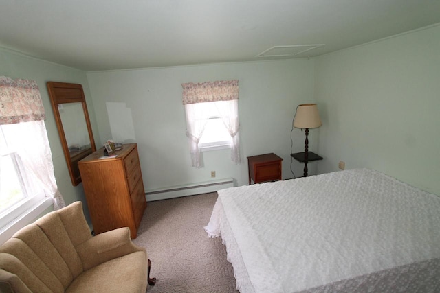 bedroom with carpet floors and a baseboard heating unit