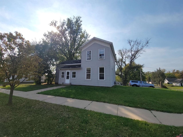 view of front of home with a front yard