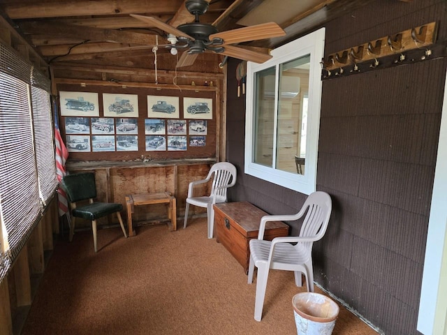 sunroom / solarium featuring ceiling fan