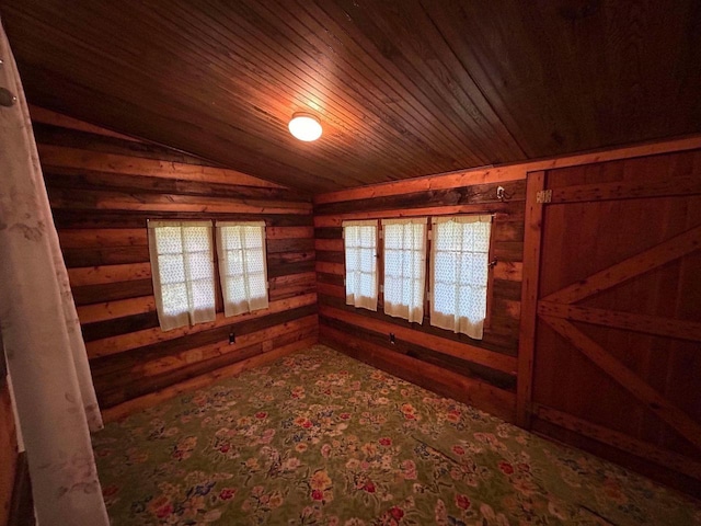 interior space with wood ceiling, vaulted ceiling, wood walls, and hardwood / wood-style floors