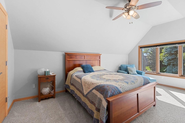 carpeted bedroom featuring lofted ceiling and ceiling fan