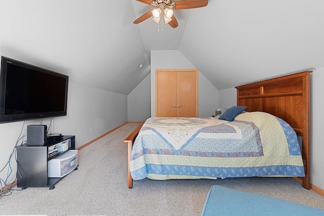 bedroom featuring carpet floors, lofted ceiling, and ceiling fan