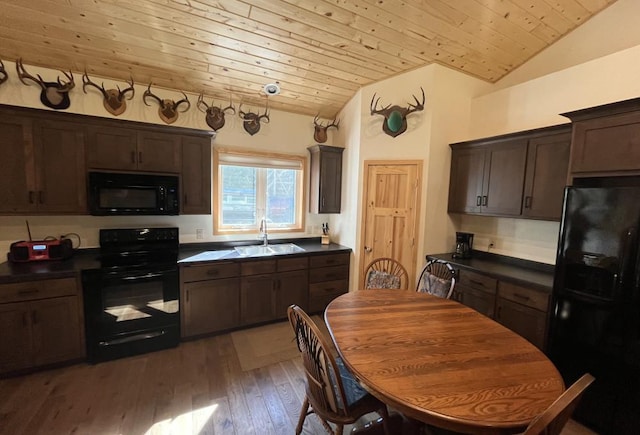 kitchen featuring sink, vaulted ceiling, black appliances, hardwood / wood-style floors, and wooden ceiling